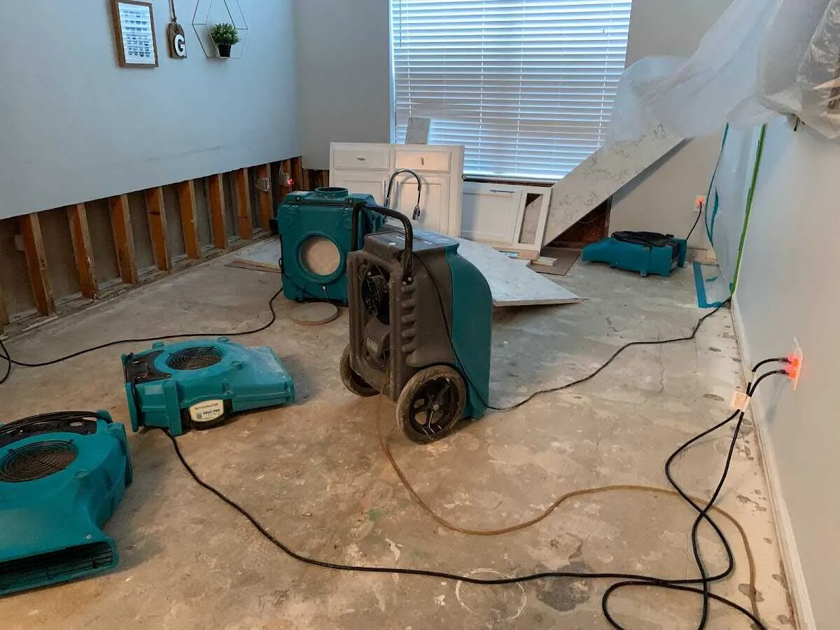 Dehumidifier in flood-cut room for Water Damage Restoration in Cumming